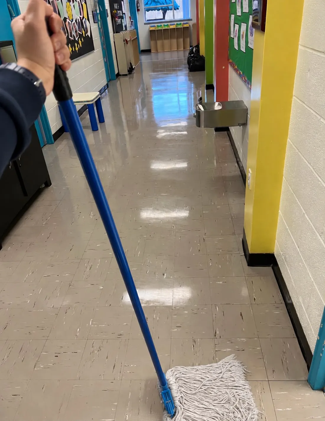 A school corridor with freshly mopped, shining floors